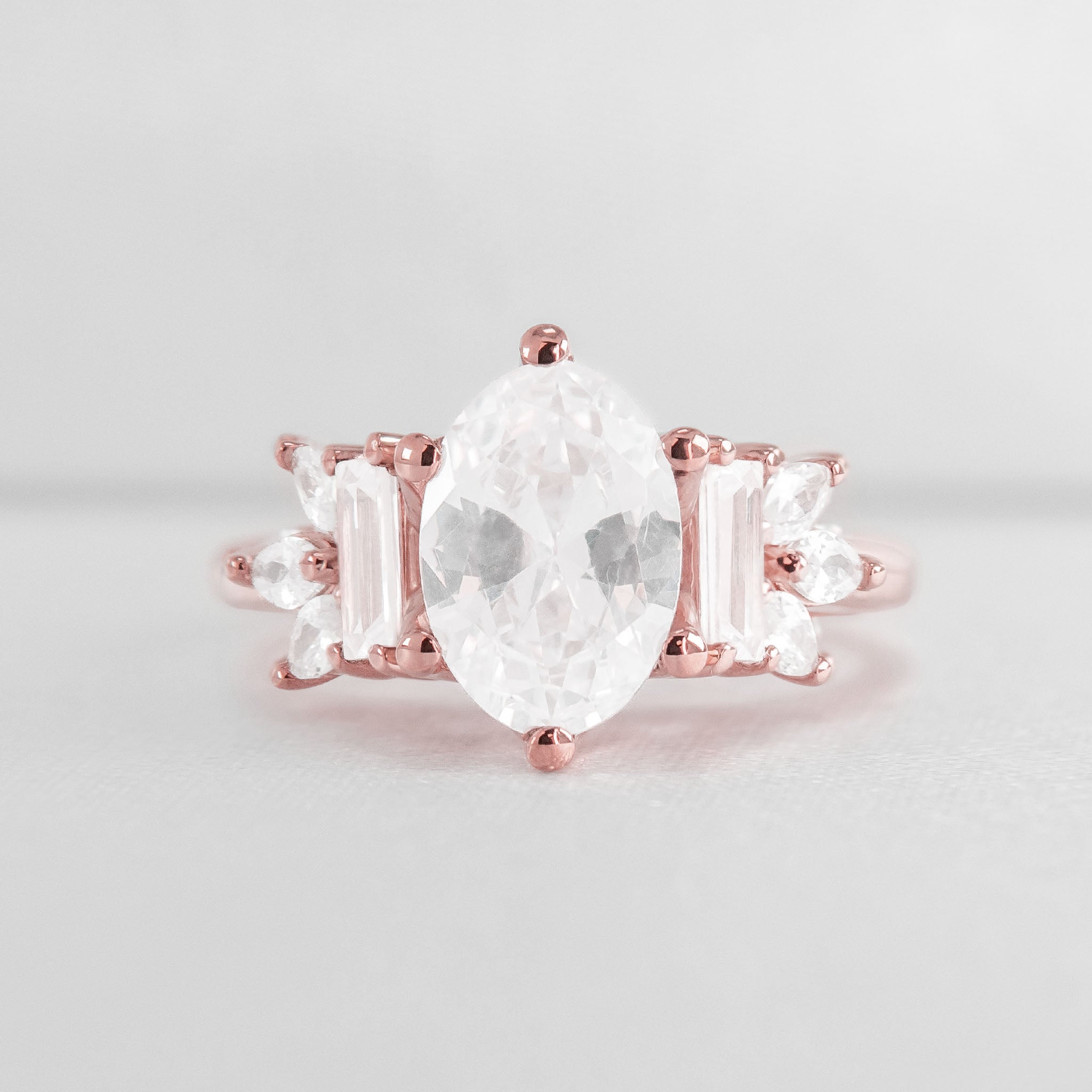 Shown in 3 Carat Diamond*The Juniper Baguette and Marquise Diamond Engagement Ring with oval cut diamond in rose gold from front by Lisa Robin#color_14k-rose-gold