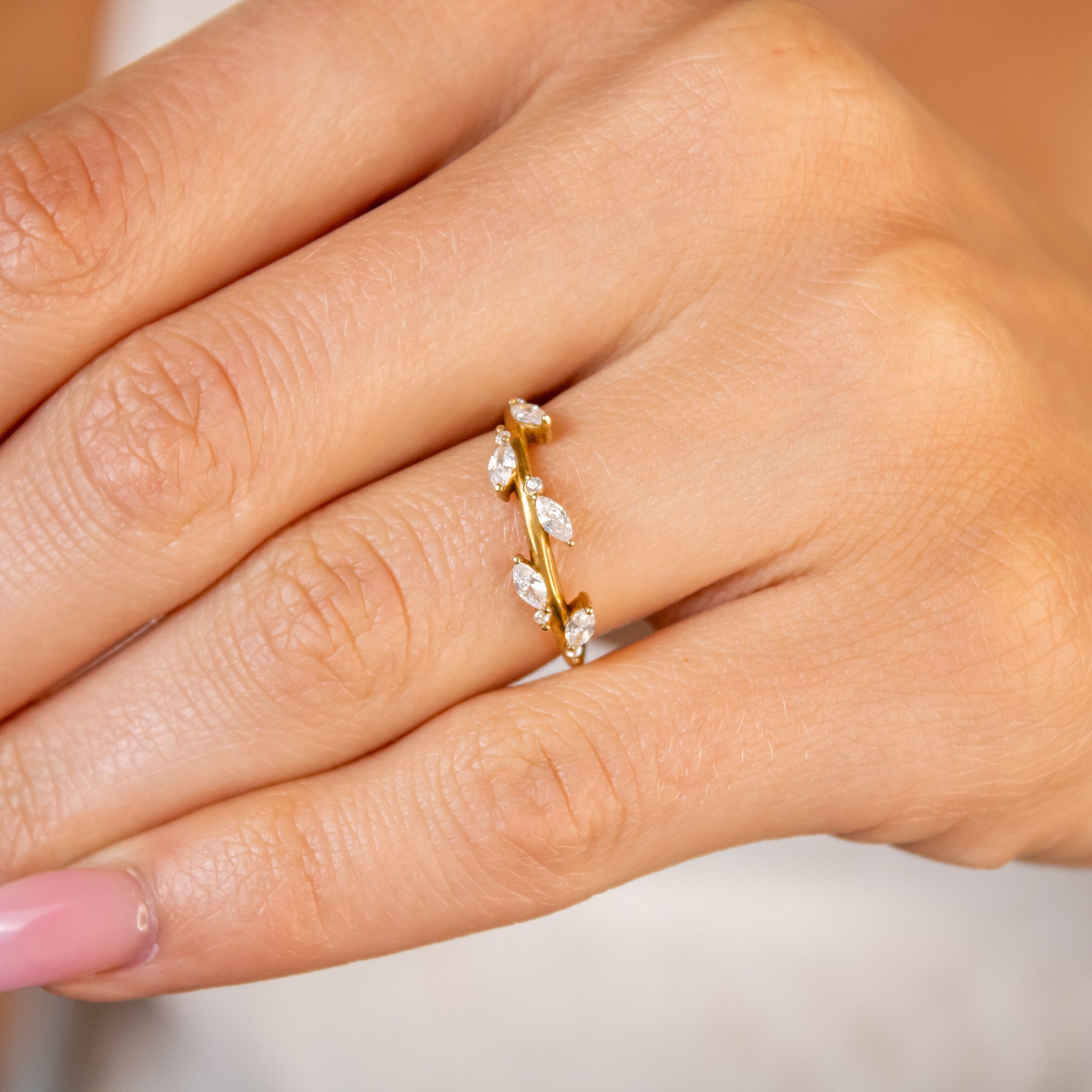 The Kaliko leaf marquise cut diamond in 14K yellow gold on model hand by Lisa Robin jewelry
