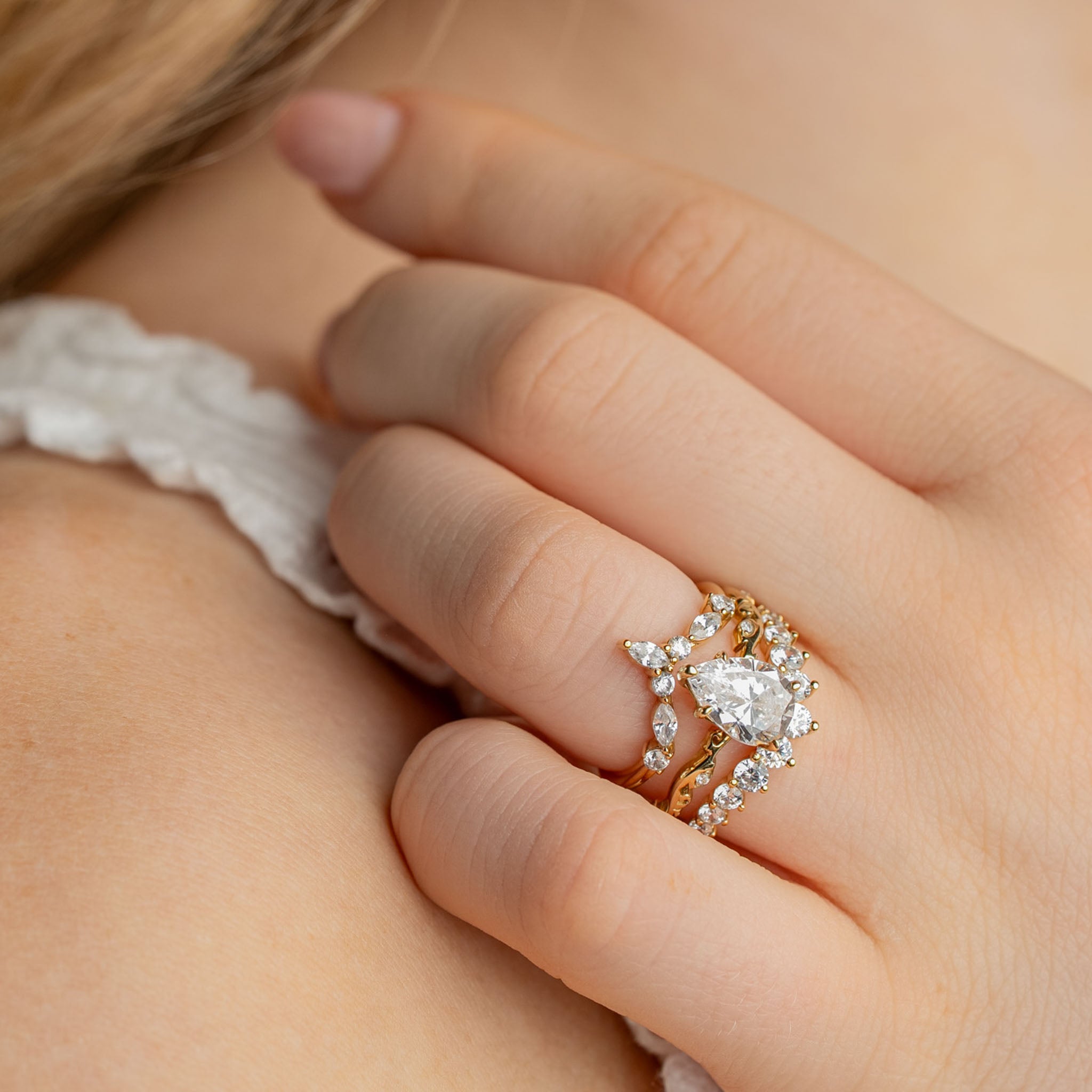 The Kendall curved diamond 14K yellow gold wedding ring on model hand by Lisa Robin#color_14k-yellow-gold