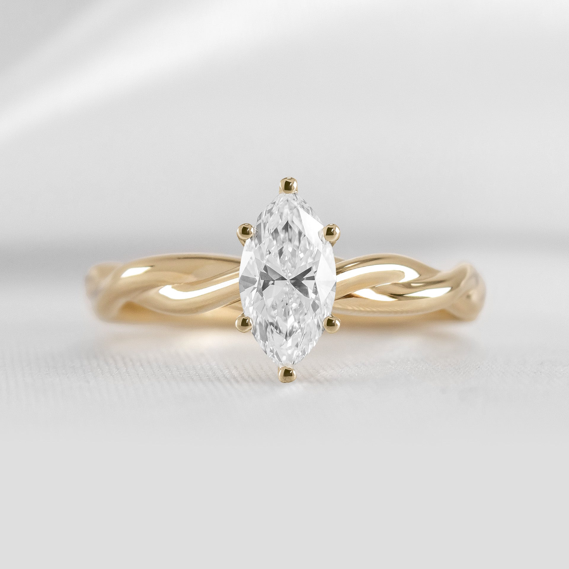Shown in 1.5 Carat*The Leila Twist Engagement Ring with marquise cut diamond in yellow gold by Lisa Robin#color_14k-yellow-gold#shape_marquise