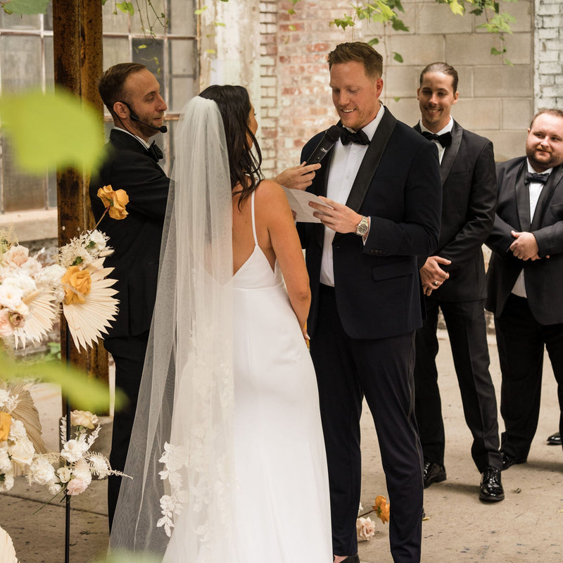 Couple exchanging vows at wedding ceremony | Lisa Robin