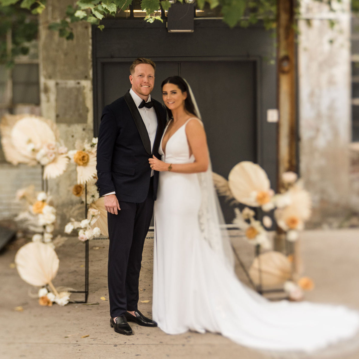 Post wedding photo of bride and groom in front of Strongwater Event Center Columbus Ohio | Lisa Robin