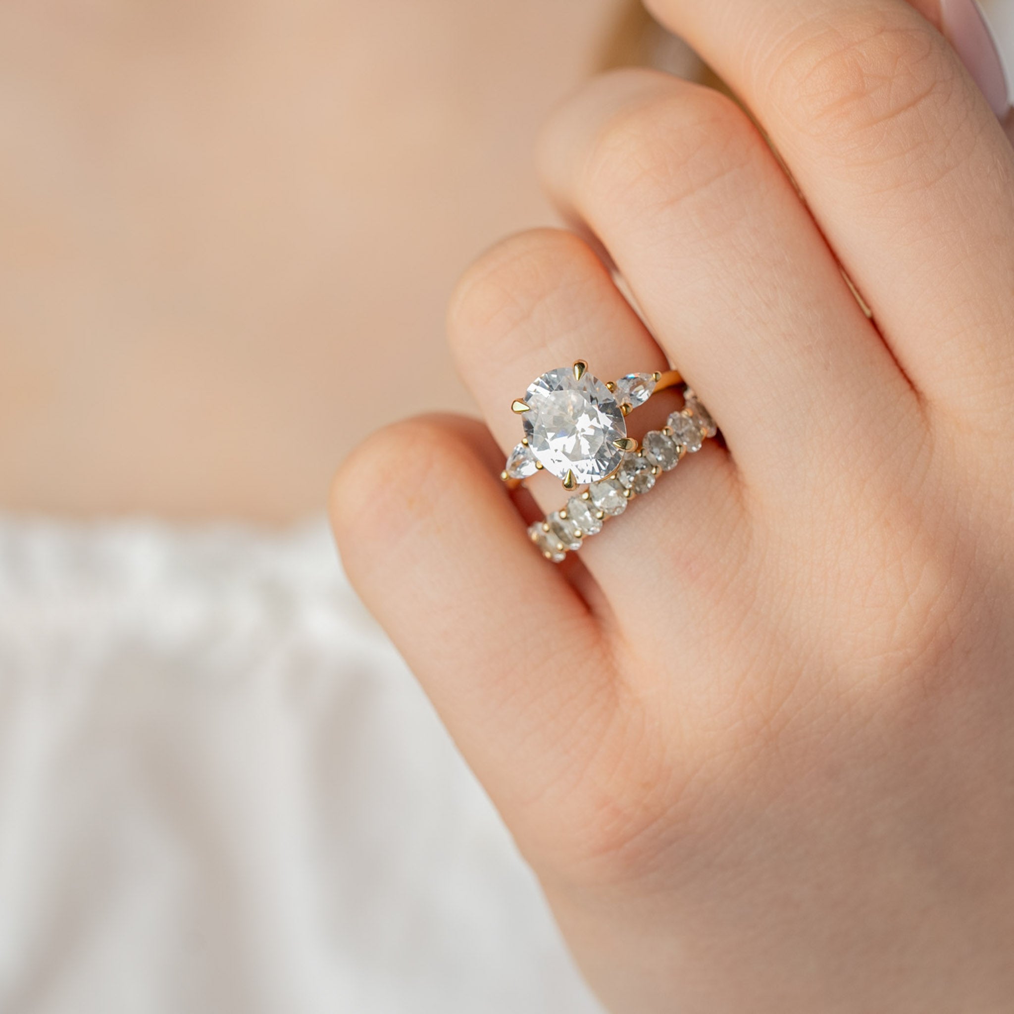 Shown in 4 Carat * The Sutton Oval Diamond Eternity Ring on model hand | Lisa Robin#color_14k-yellow-gold