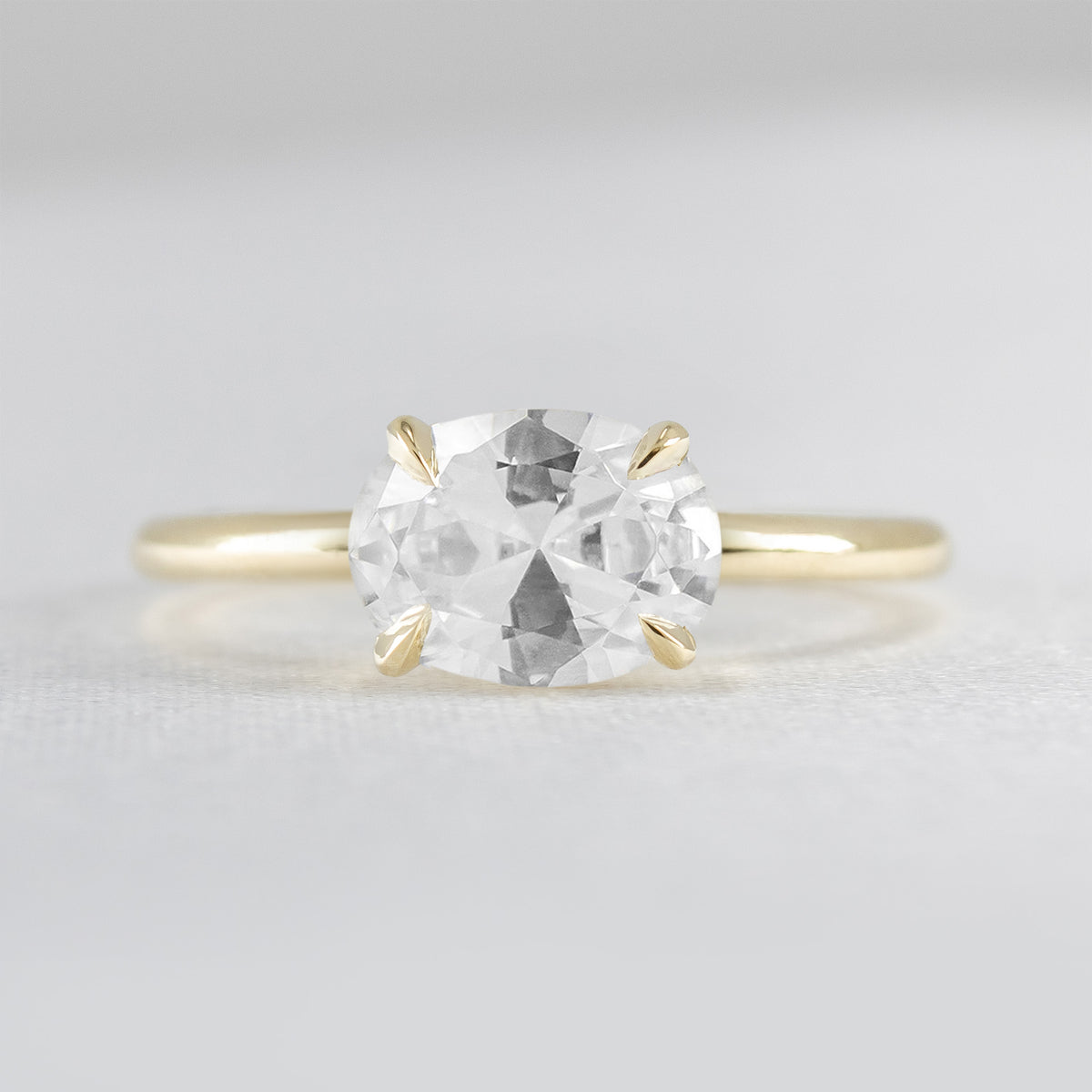 Shown in 1.6 Carat*The Mia claw prong East West oval cut Diamond Solitaire Engagement Ring in yellow gold by Lisa Robin#color_14k-yellow-gold#shape_oval