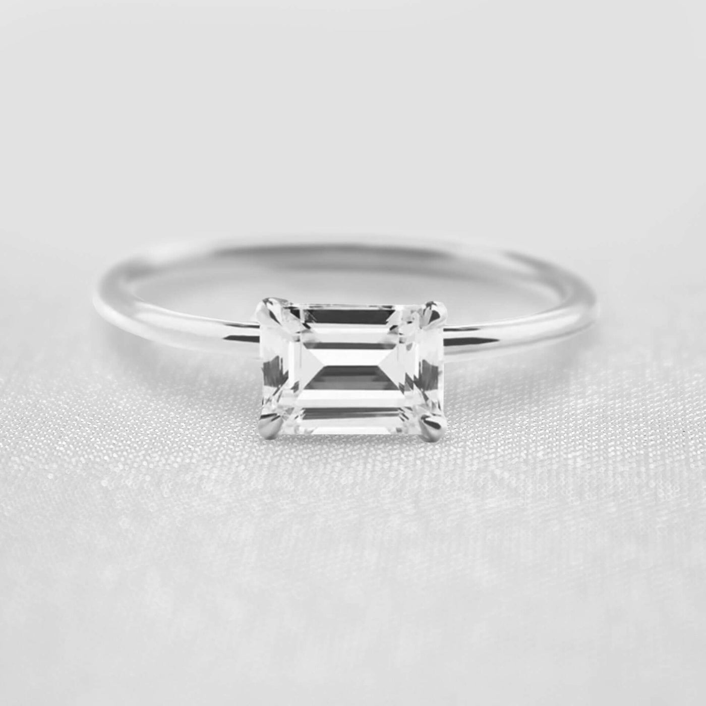 Shown in 1.0 Carat * The Mia East West Emerald Cut Moissanite Solitaire Engagement Ring | Lisa Robin#shape_emerald