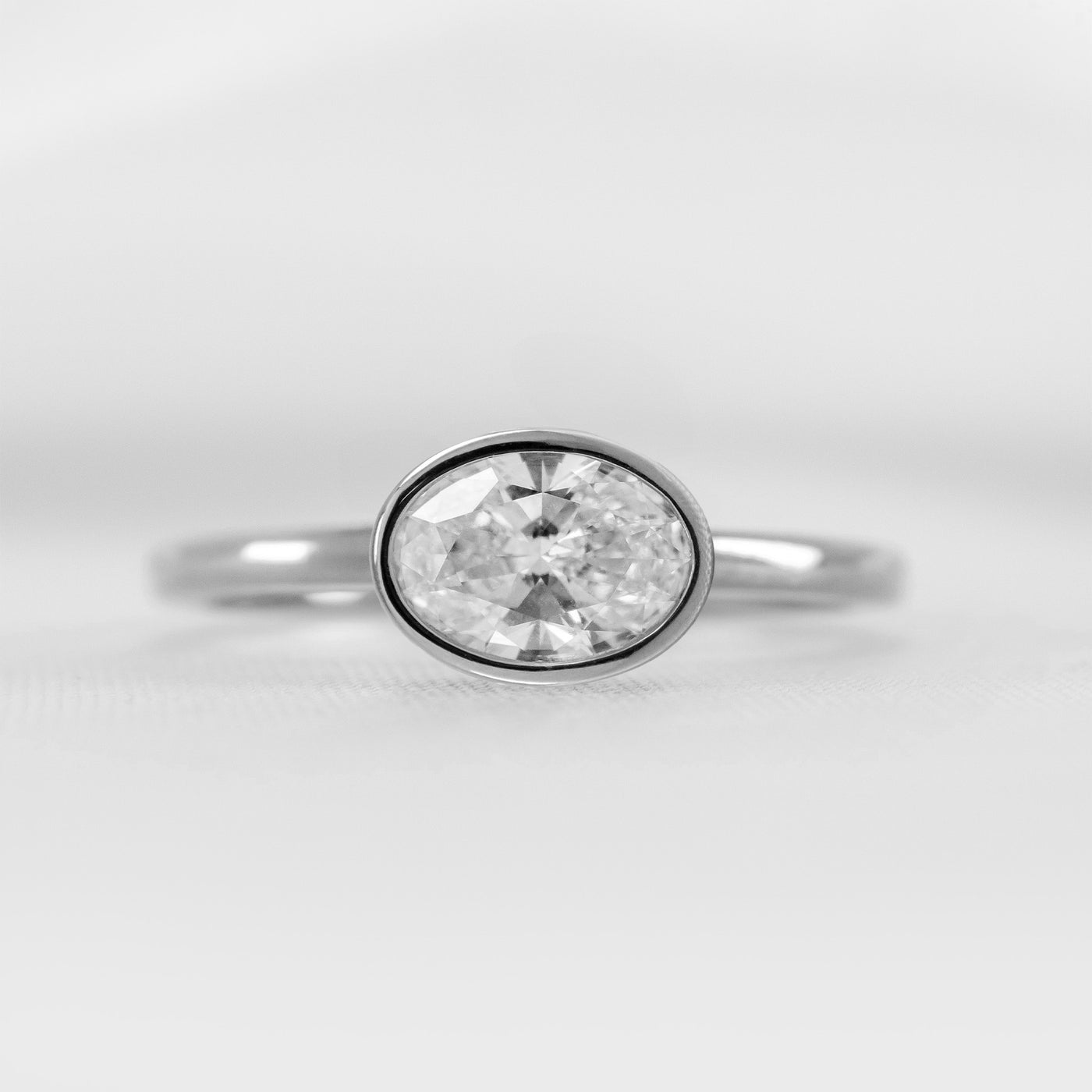 Shown in 1.5 Carat * The Nova Bezel East West Diamond Ring | Lisa Robin#shape_oval