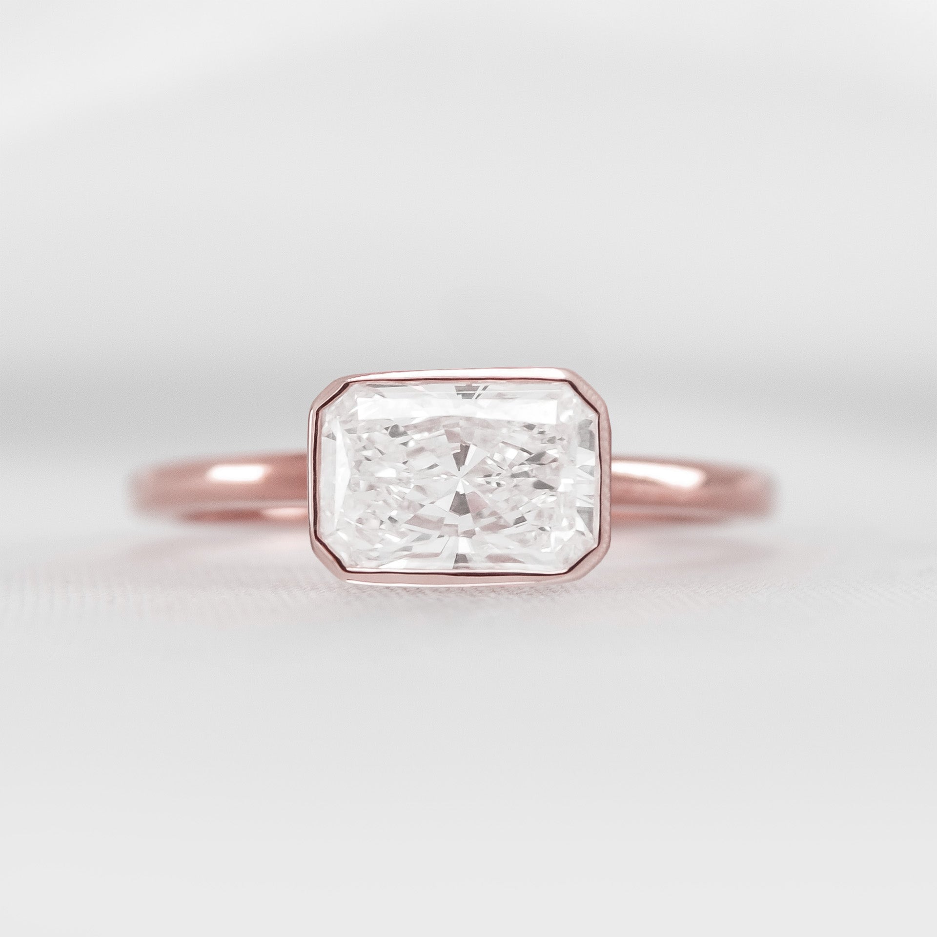 Shown in 1.75 Carat * The Nova Bezel East West Diamond Ring | Lisa Robin#color_14k-rose-gold