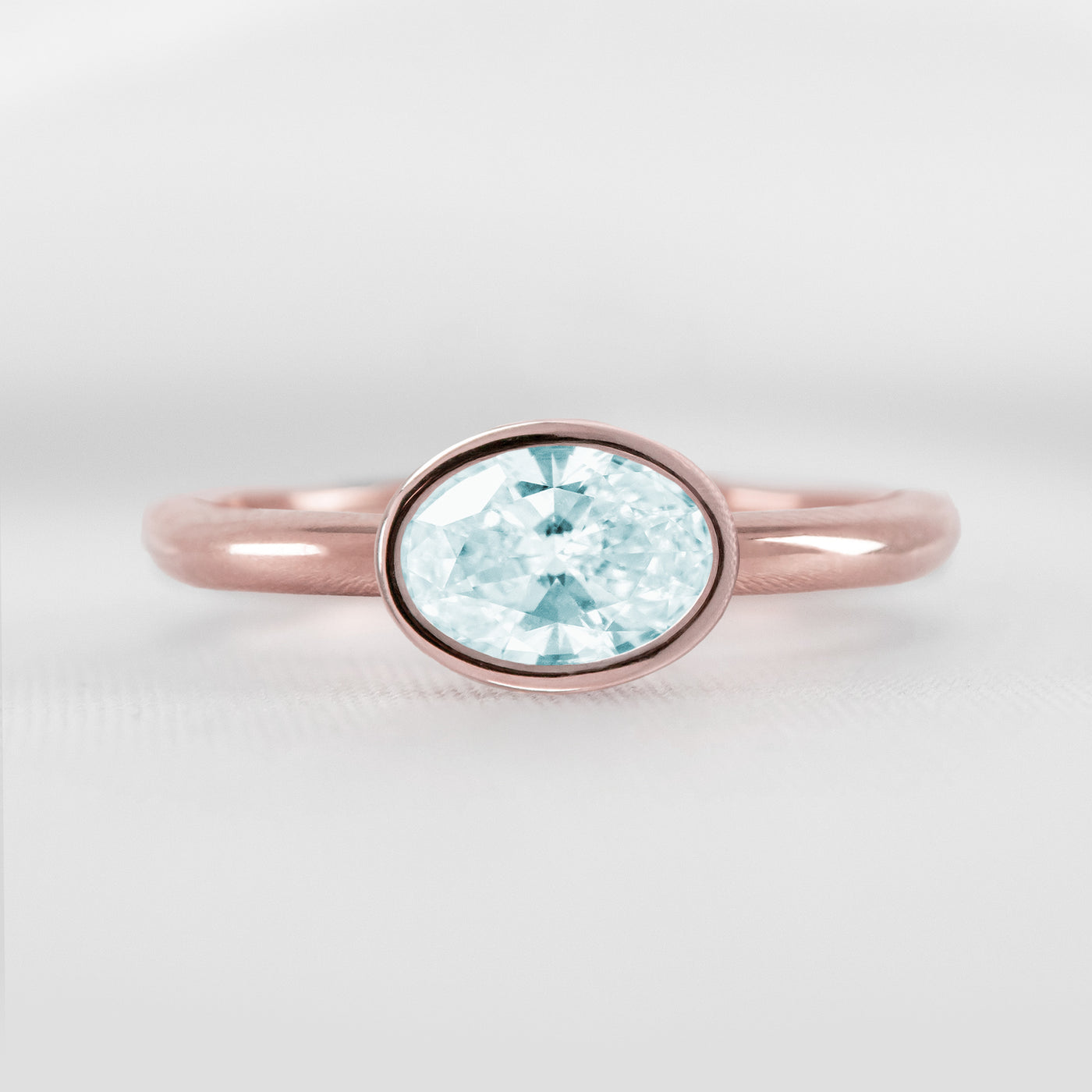 Shown in 1.30 carat Aquamarine* The Nova East West Bezel Aquamarine Engagement Ring | Lisa Robin#color_14k-rose-gold