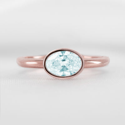 Shown in 1.30 carat Aquamarine* The Nova East West Bezel Aquamarine Engagement Ring | Lisa Robin#color_14k-rose-gold