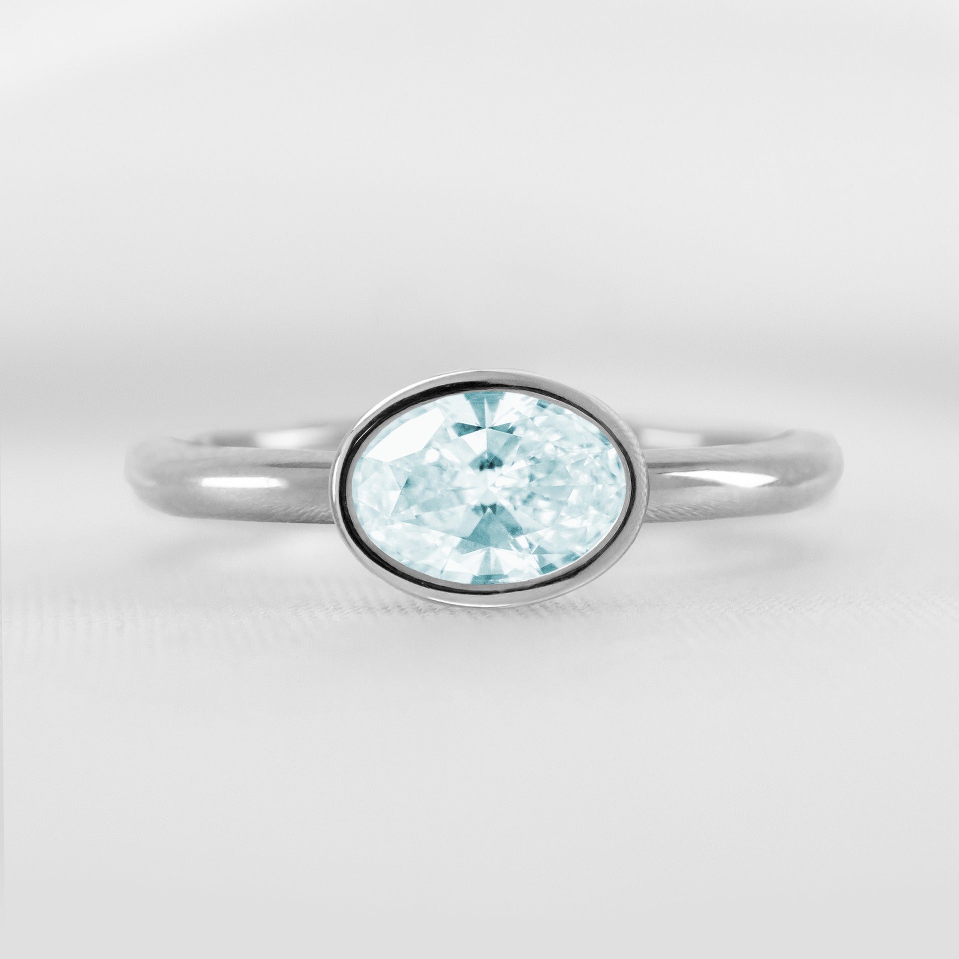 Shown in 1.30 carat Aquamarine* The Nova East West Bezel Aquamarine Engagement Ring | Lisa Robin#color_14k-white-gold