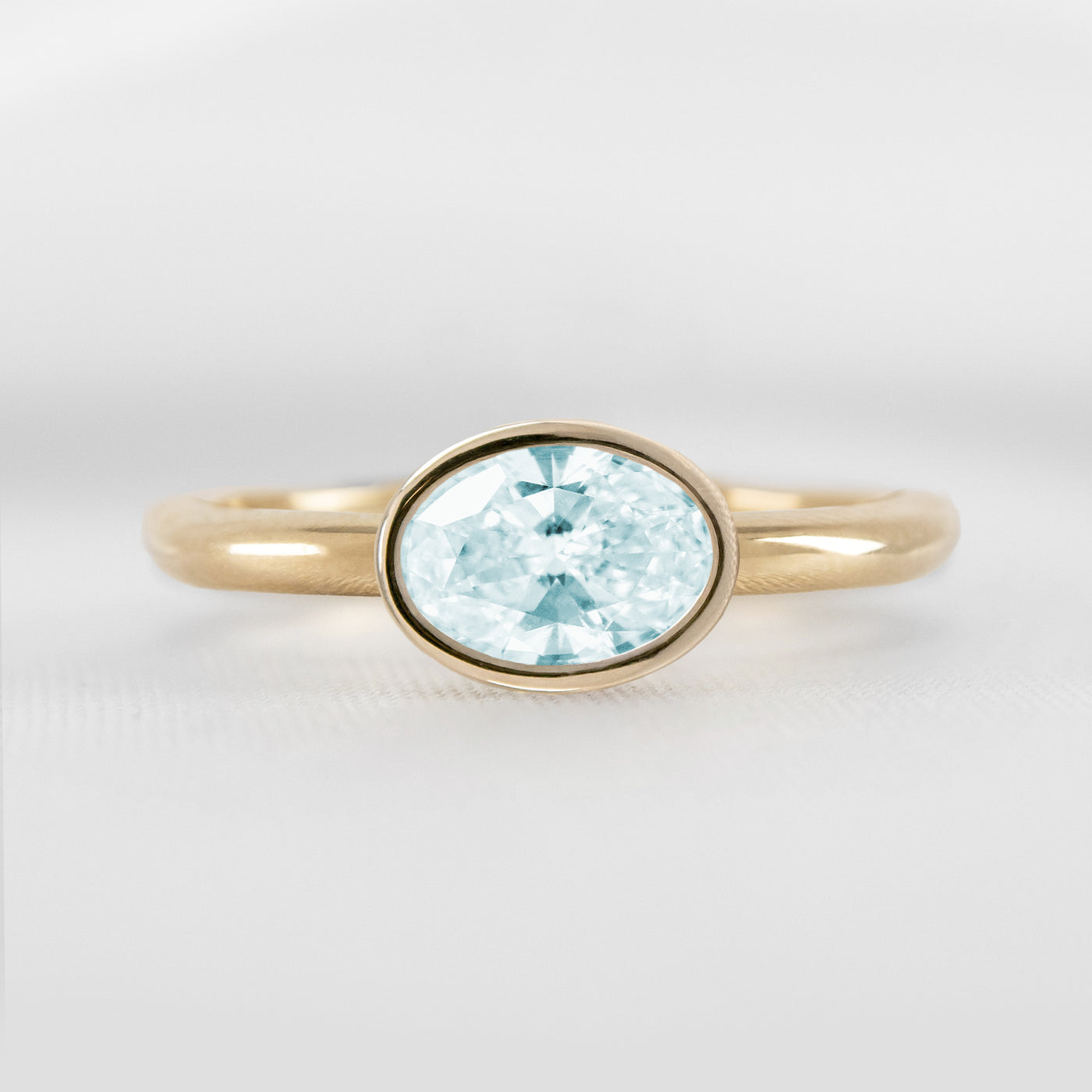 Shown in 1.30 carat Aquamarine* The Nova East West Bezel Aquamarine Engagement Ring | Lisa Robin#color_14k-yellow-gold