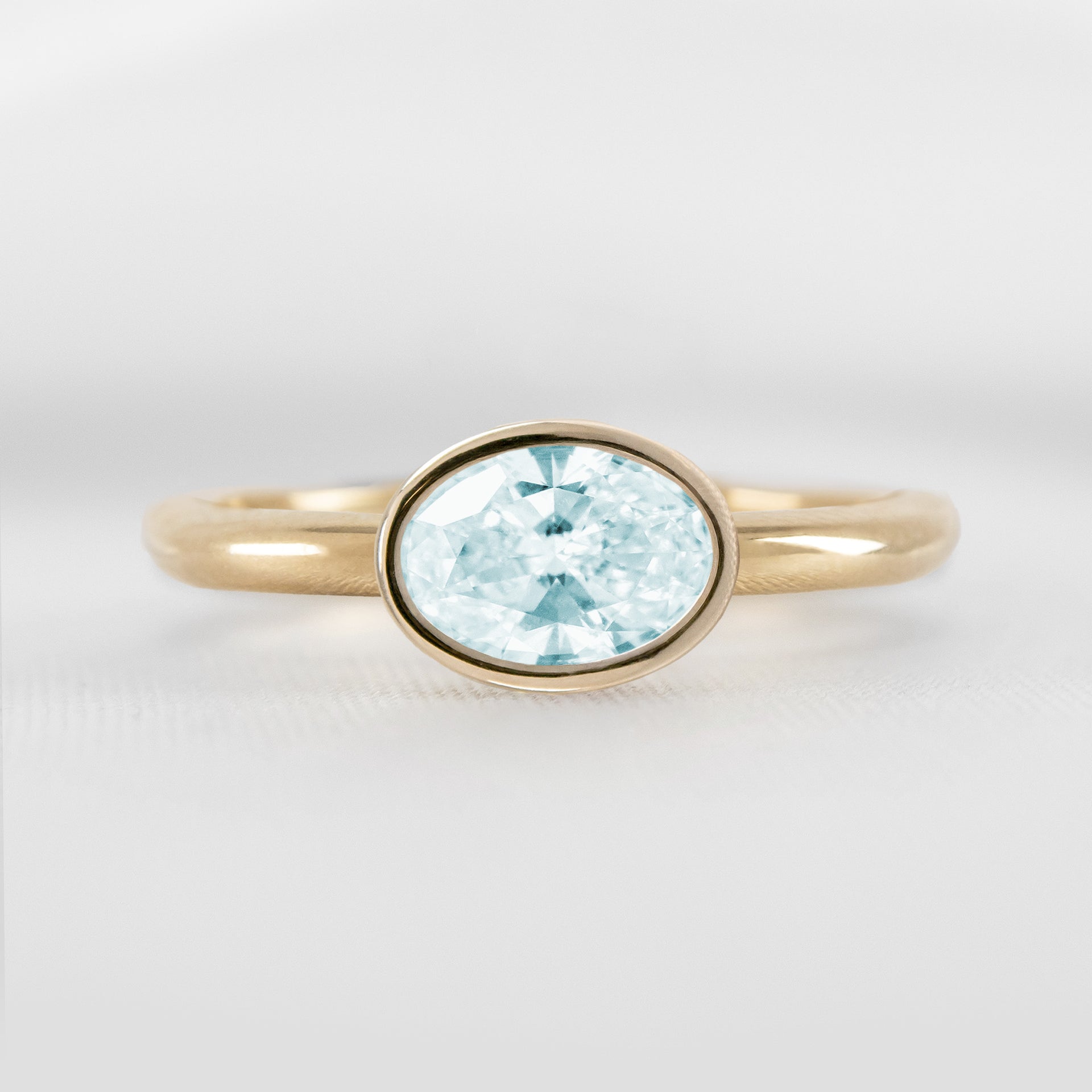 Shown in 1.30 carat Aquamarine* The Nova East West Bezel Aquamarine Engagement Ring | Lisa Robin#color_14k-yellow-gold