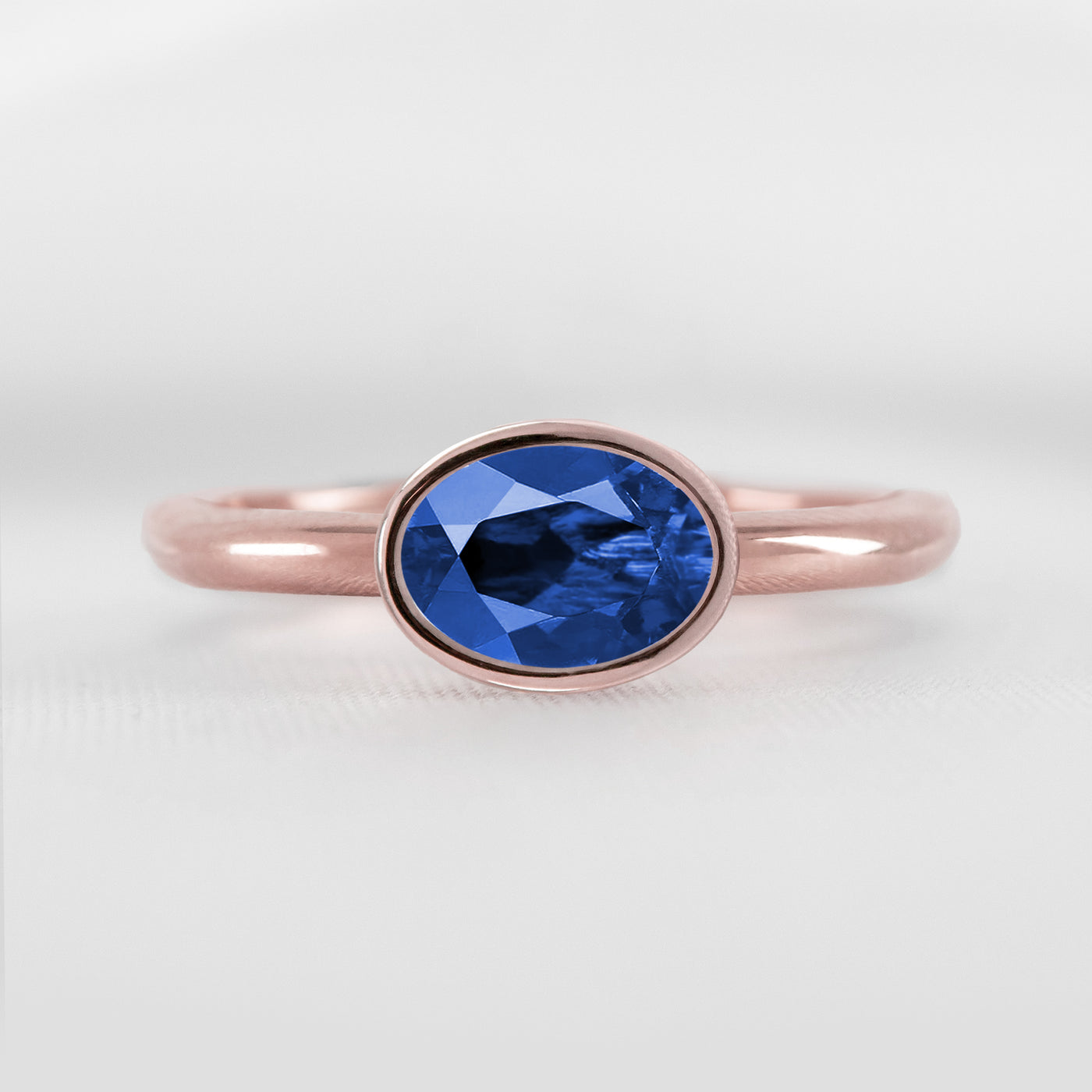Shown in 1.30 Carat Blue Sapphire * The Nova East West Sapphire Bezel Engagement Ring | Lisa Robin#color_14k-rose-gold