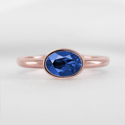 Shown in 1.30 Carat Blue Sapphire * The Nova East West Sapphire Bezel Engagement Ring | Lisa Robin#color_14k-rose-gold