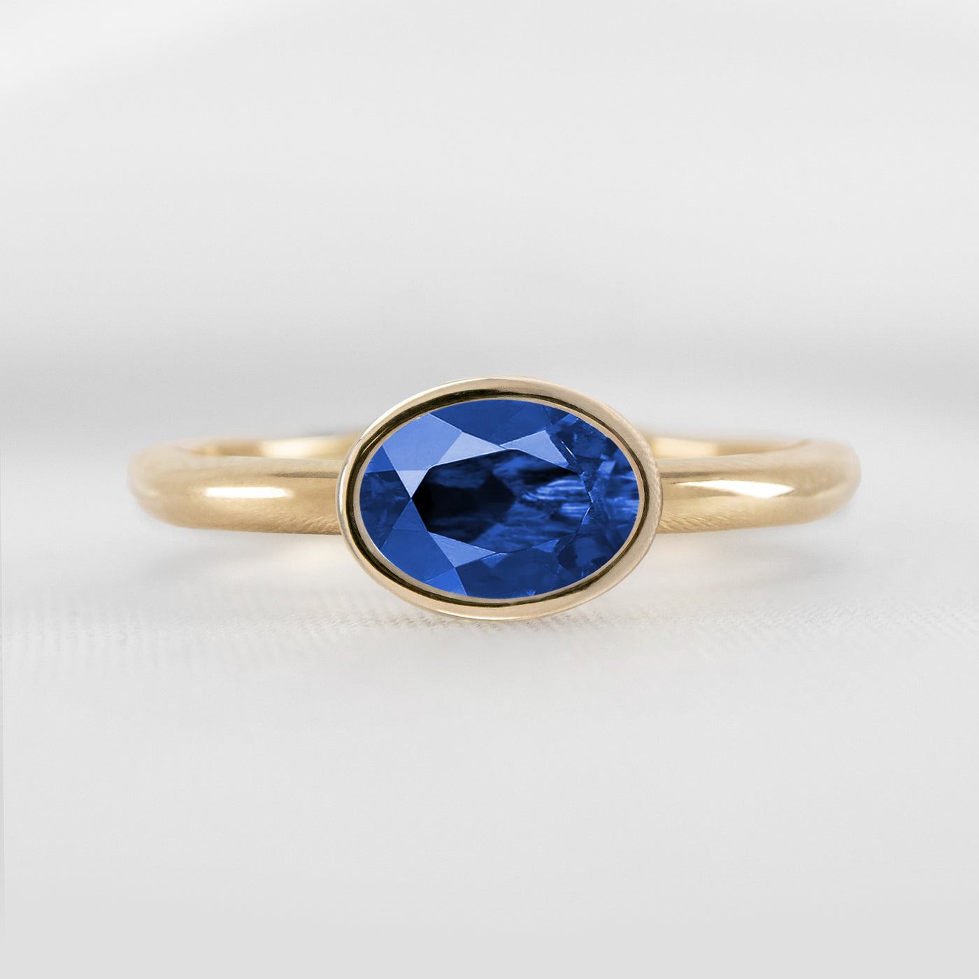 Shown in 1.30 Carat Blue Sapphire * The Nova East West Sapphire Bezel Engagement Ring | Lisa Robin#color_14k-yellow-gold