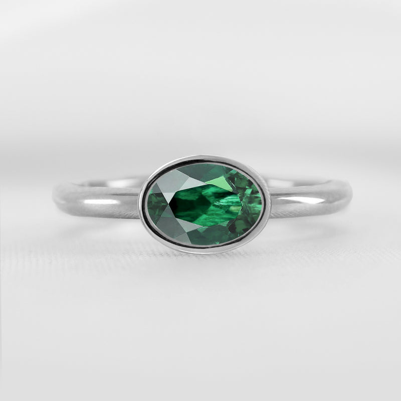 Shown in 1.30 carat Green Emerald* The Nova Green Emerald East-West Bezel Engagement Ring | Lisa Robin