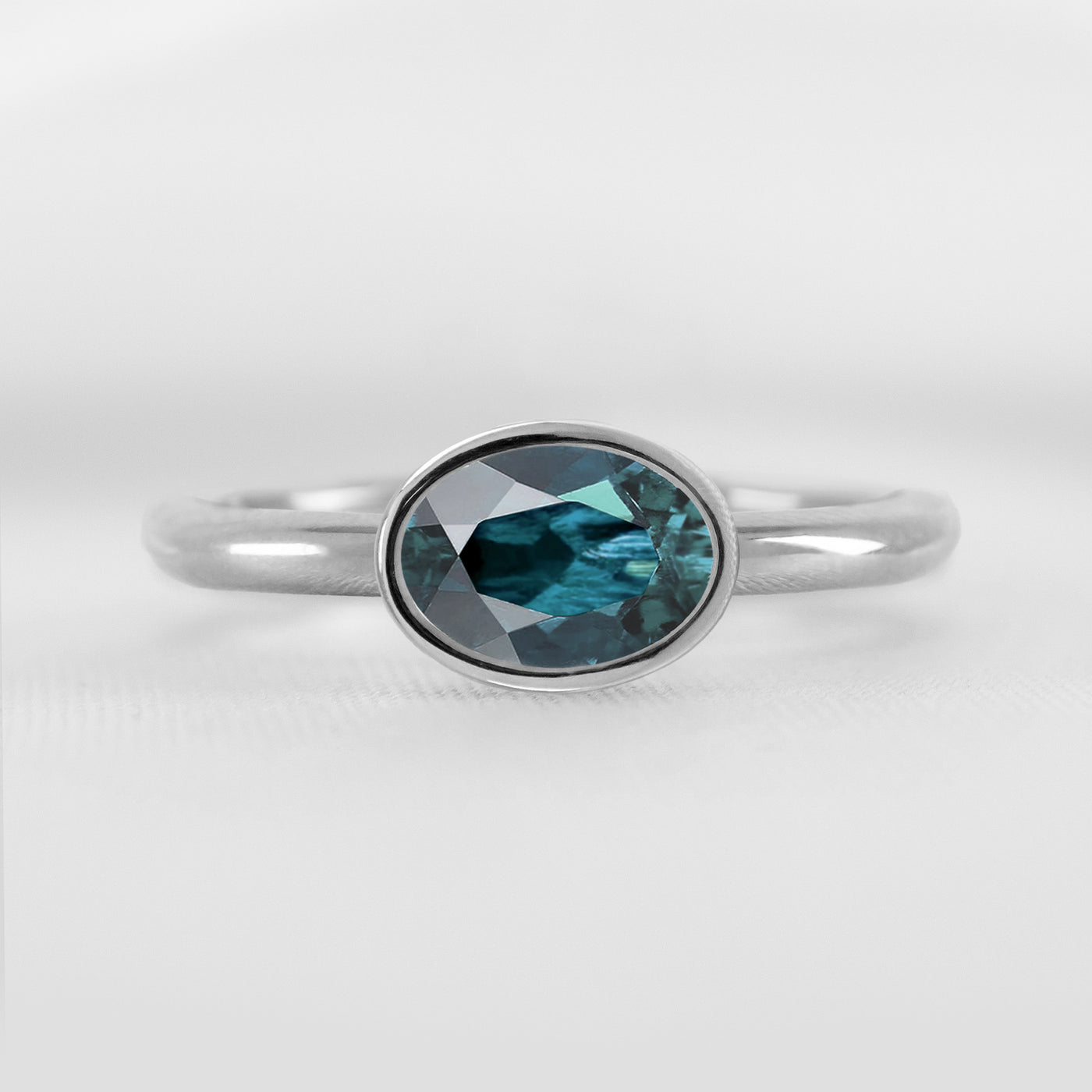 Shown in 1.30 Carat Teal Sapphire * The Nova East West Sapphire Bezel Engagement Ring#color_platinum