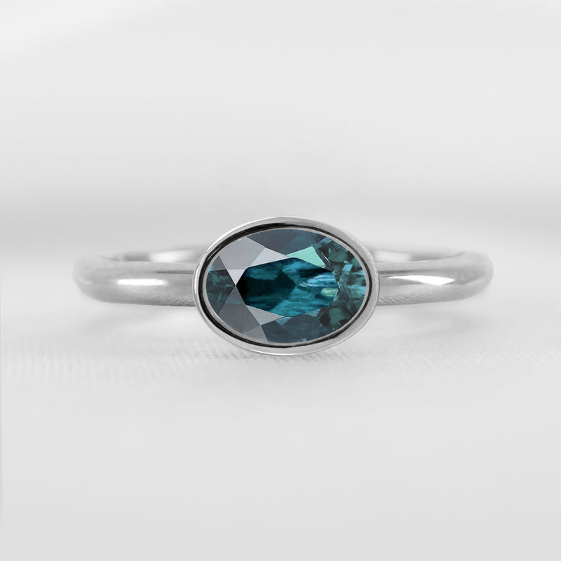 Shown in 1.30 Carat Teal Sapphire * The Nova East West Sapphire Bezel Engagement Ring