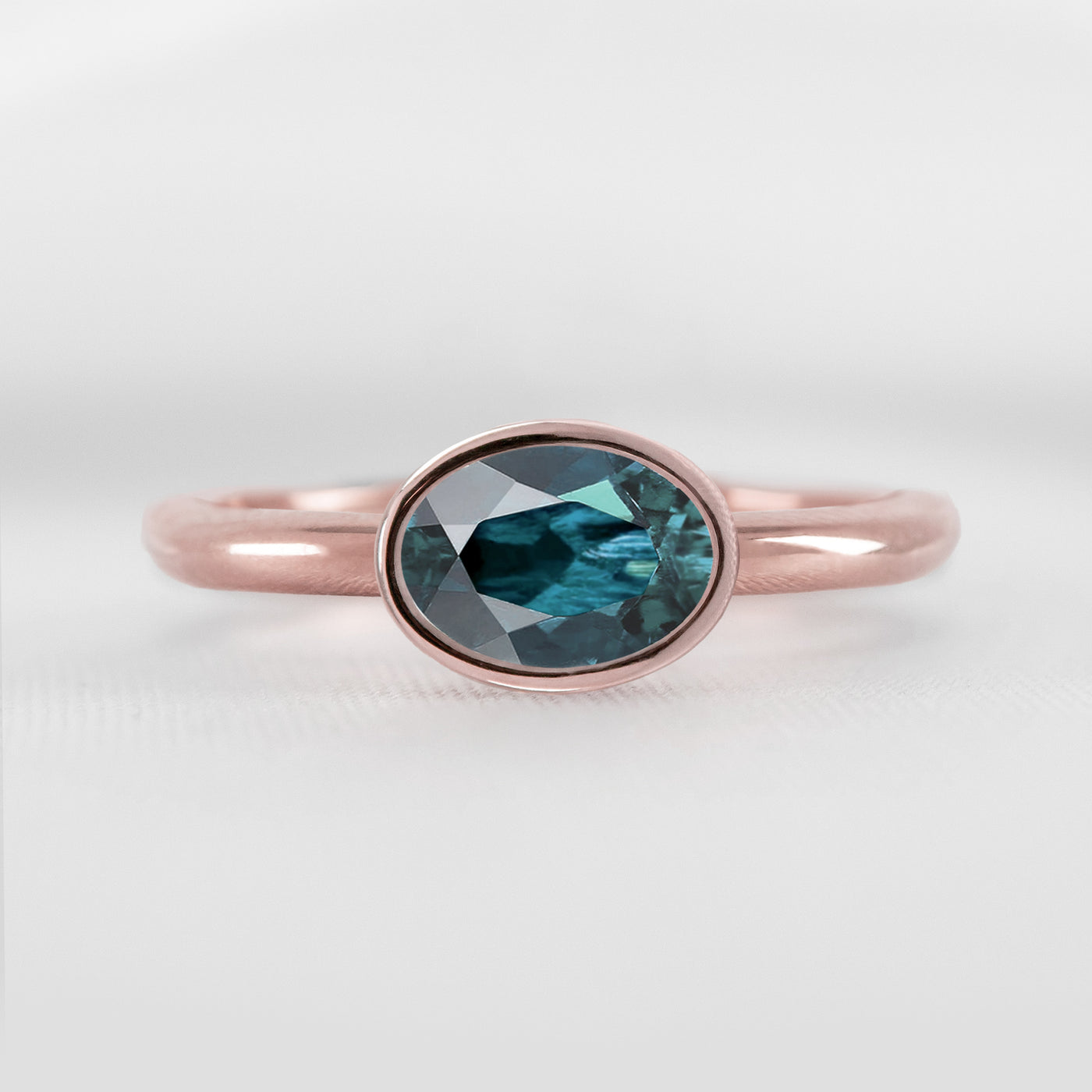 Shown in 1.30 Carat Teal Sapphire * The Nova East West Sapphire Bezel Engagement Ring | Lisa Robin#color_14k-rose-gold