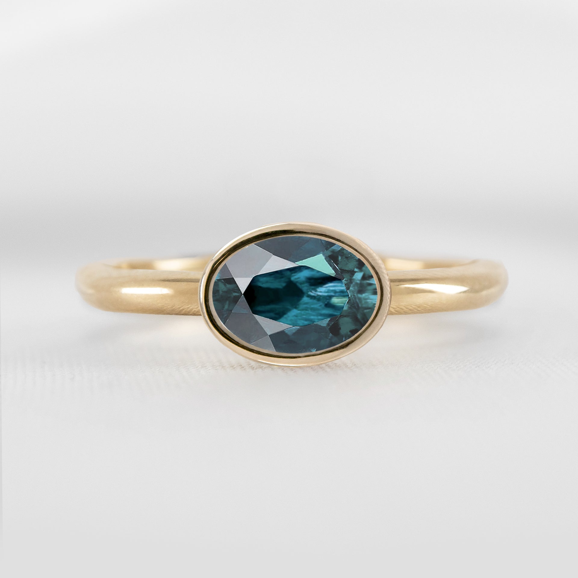 Shown in 1.30 Carat Teal Sapphire * The Nova East West Sapphire Bezel Engagement Ring | Lisa Robin#color_14k-yellow-gold