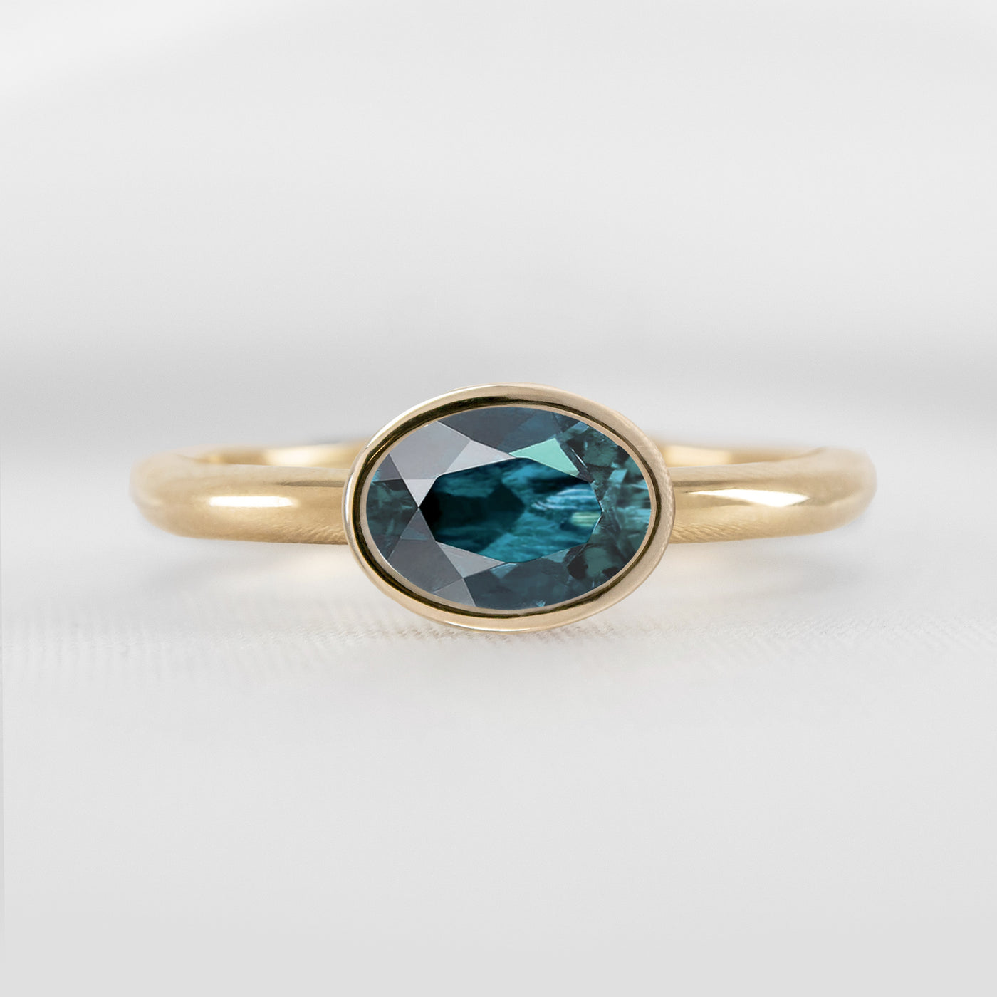 Shown in 1.30 Carat Teal Sapphire * The Nova East West Sapphire Bezel Engagement Ring | Lisa Robin#color_14k-yellow-gold