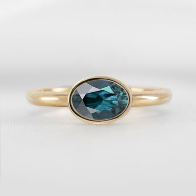 Shown in 1.30 Carat Teal Sapphire * The Nova East West Sapphire Bezel Engagement Ring | Lisa Robin#color_14k-yellow-gold