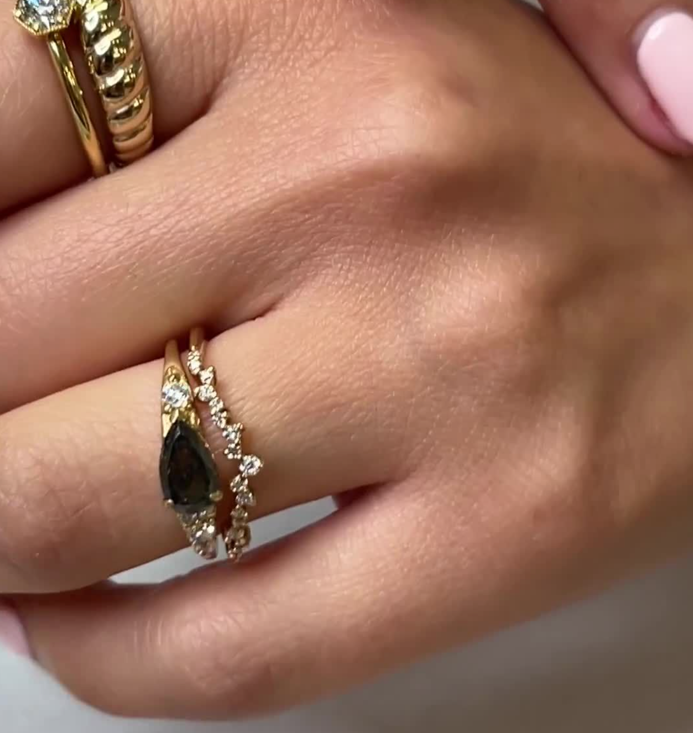 Peyton salt and pepper pear shaped diamond east west cluster ring with Twilight scatter diamond wedding ring on model by Lisa Robin Jewelry#color_14k-yellow-gold