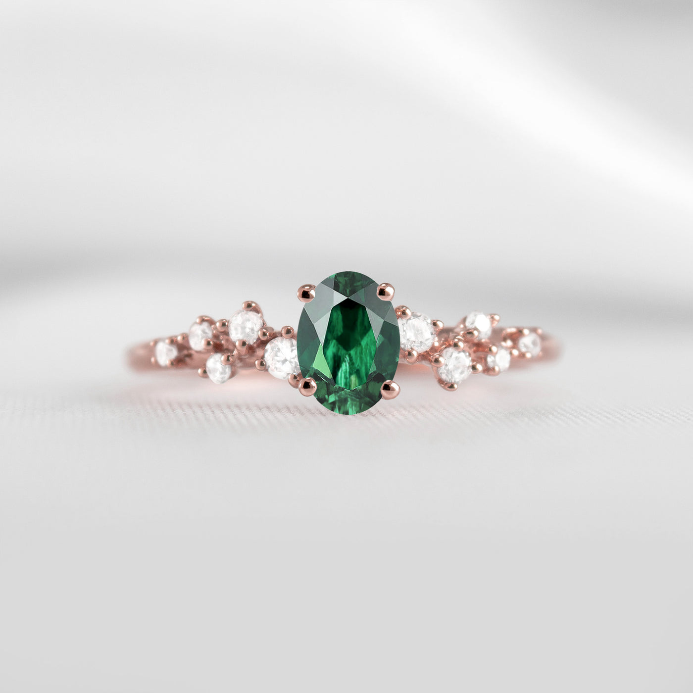 The Polaris oval green emerald and diamonds engagement ring in rose gold | Lisa Robin