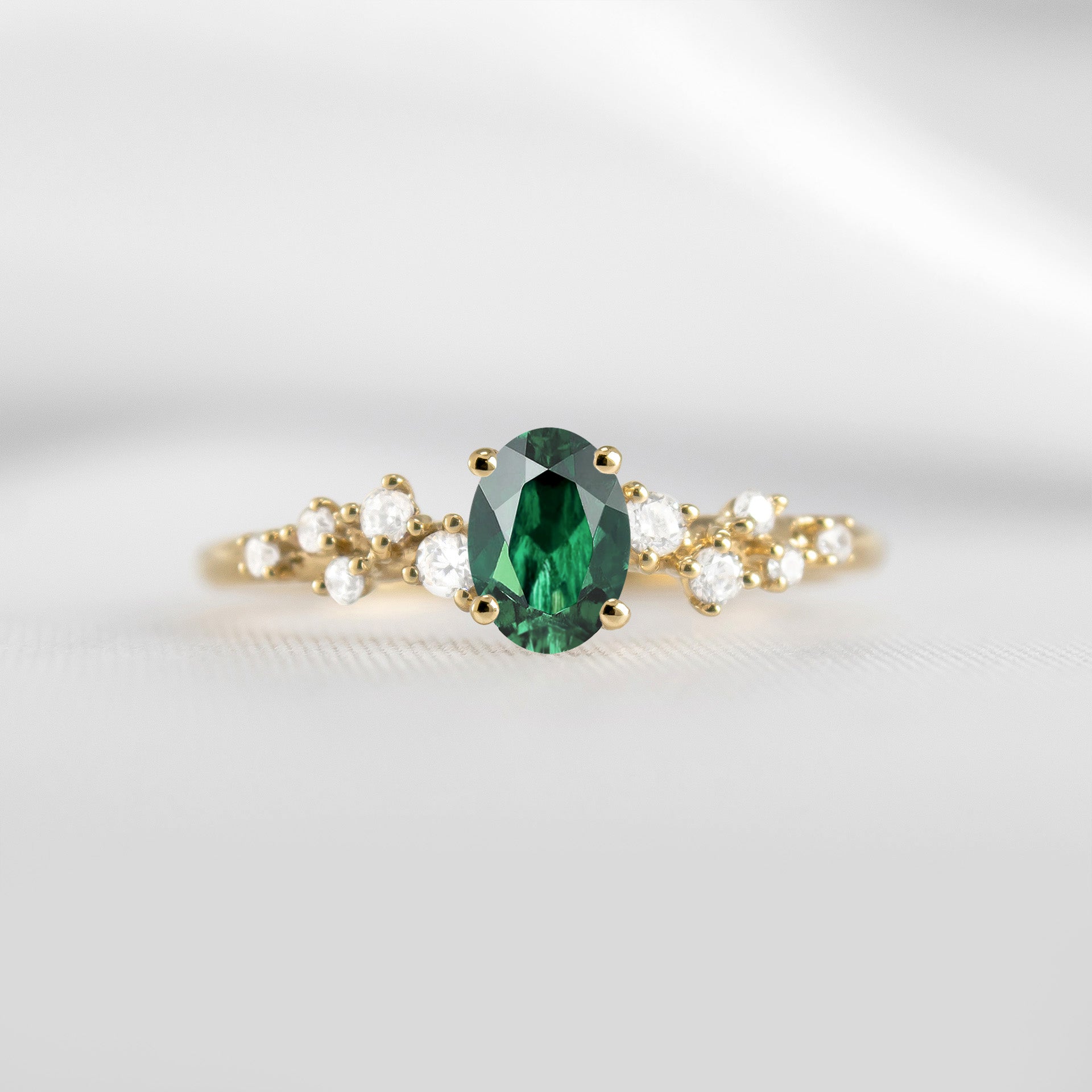 The Polaris oval green emerald and diamonds engagement ring in yellow gold | Lisa Robin
