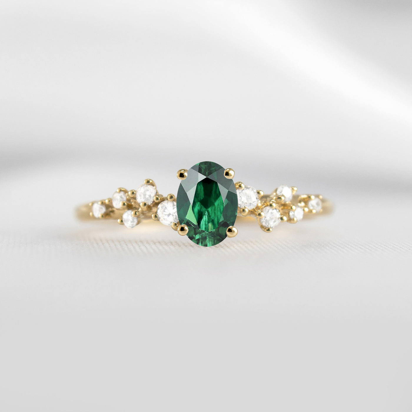 The Polaris oval green emerald and diamonds engagement ring in yellow gold | Lisa Robin