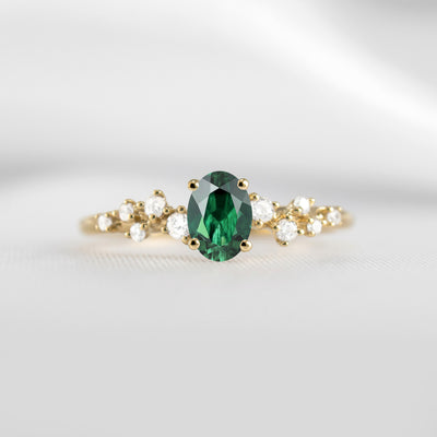 The Polaris oval green emerald and diamonds engagement ring in yellow gold | Lisa Robin