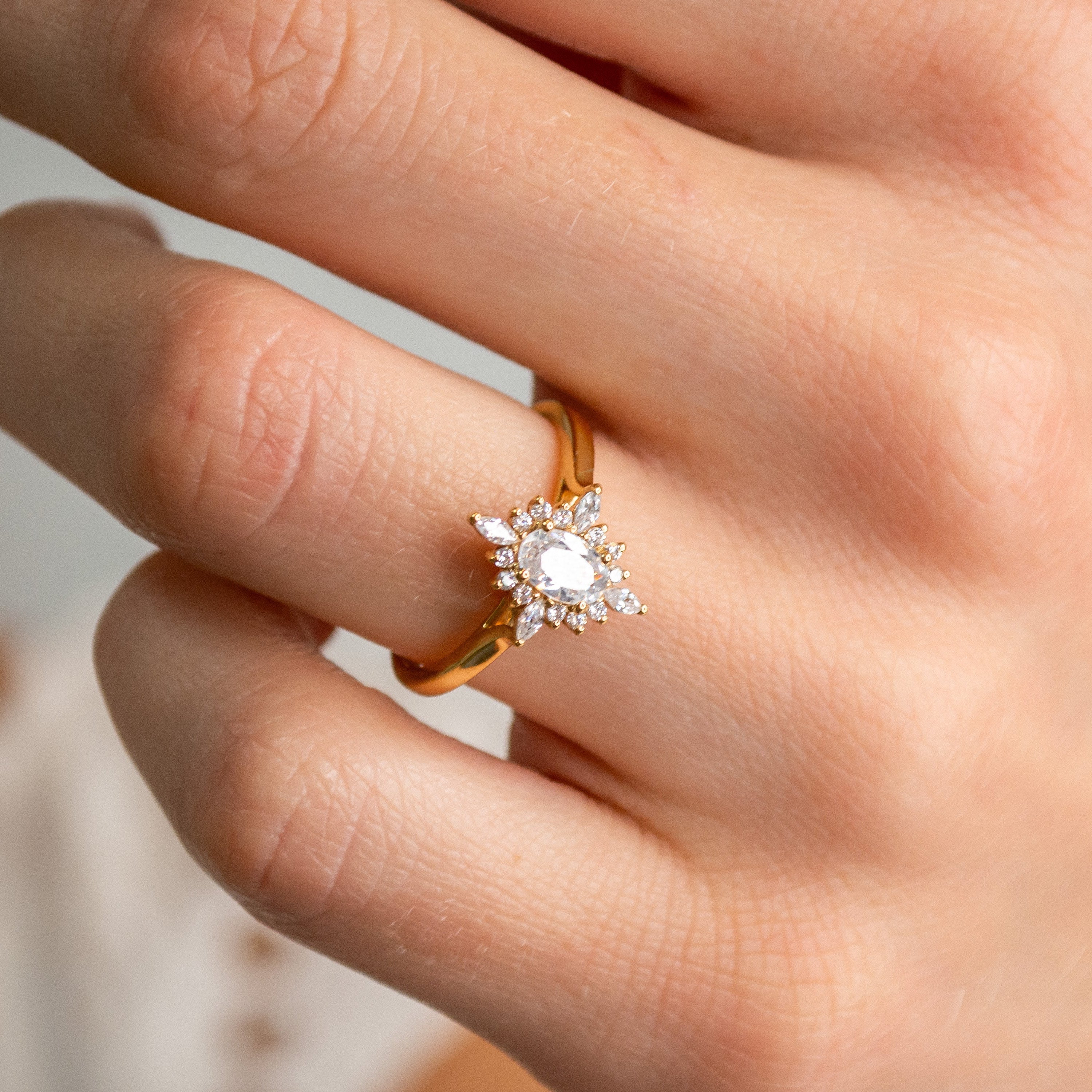 Shown in 1.5 Carat Diamond*The Revel Halo Engagement Ring with oval cut diamond in yellow gold on model hand by Lisa Robin#color_14k-yellow-gold