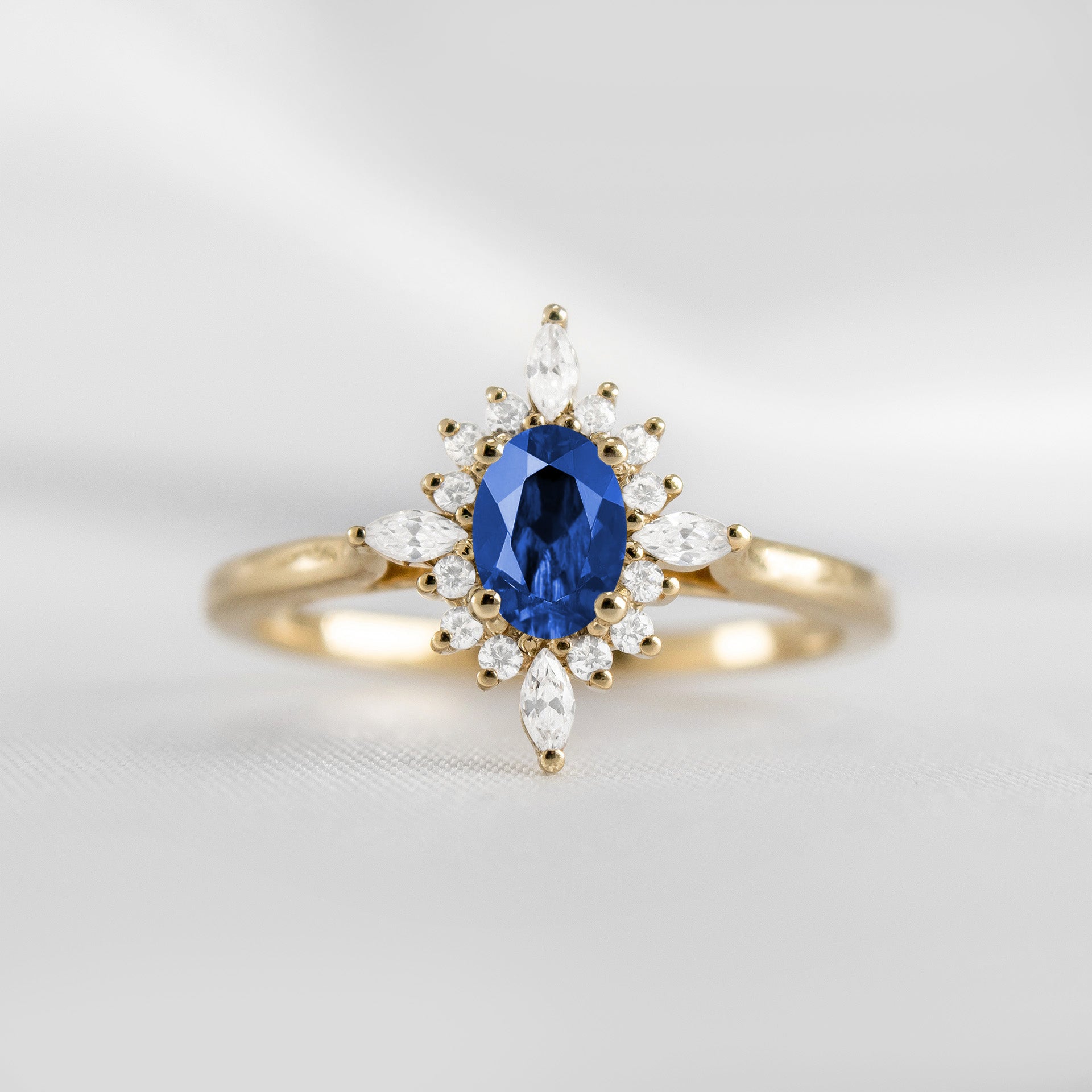 Shown in 1.0 carat Blue Sapphire* The Revel Blue Sapphire and Diamond Halo Engagement Ring | Lisa Robin#color_14k-yellow-gold