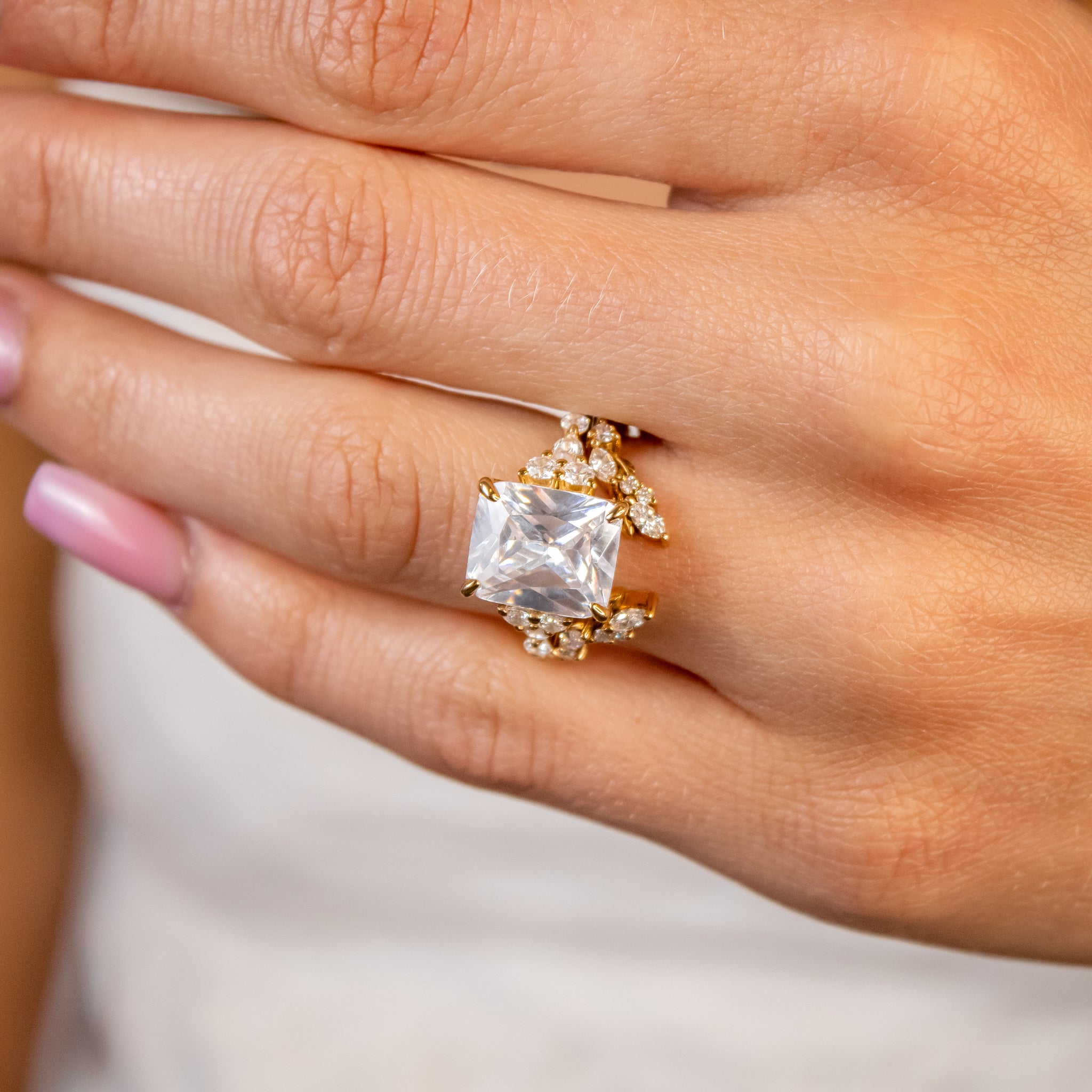 Shown in 5 Carat Diamond*The Safa Vintage Side Stone diamond Engagement Ring with radiant cut diamond in yellow gold on model hand by Lisa Robin#color_14k-yellow-gold
