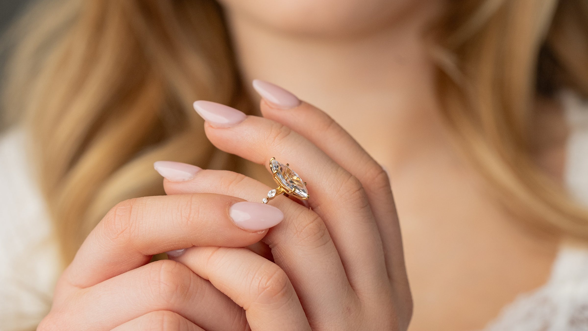 Sage marquise diamond engagement ring in yellow gold on model by Lisa Robin