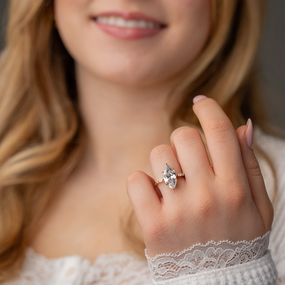 Sage marquise engagement ring on model by lisa robin