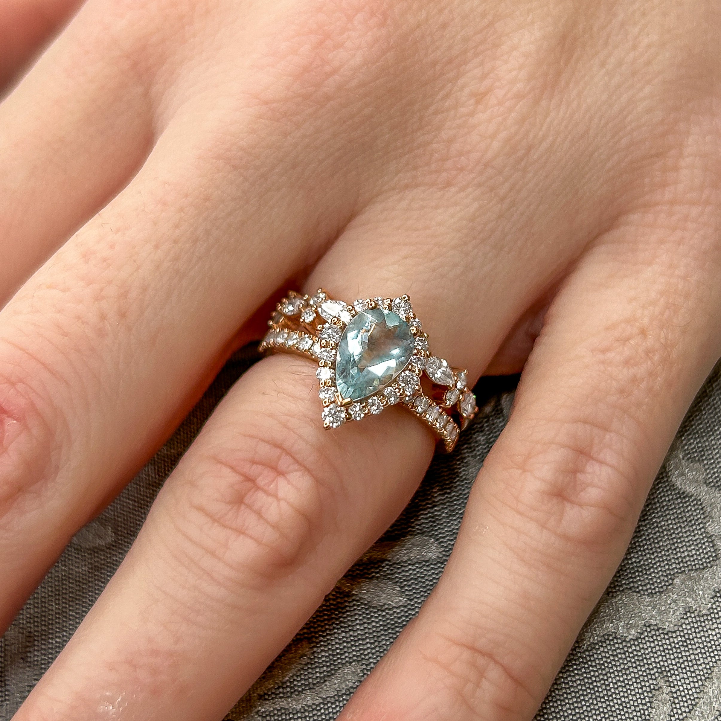 The Sierra Aquamarine Pear Halo Wedding Set