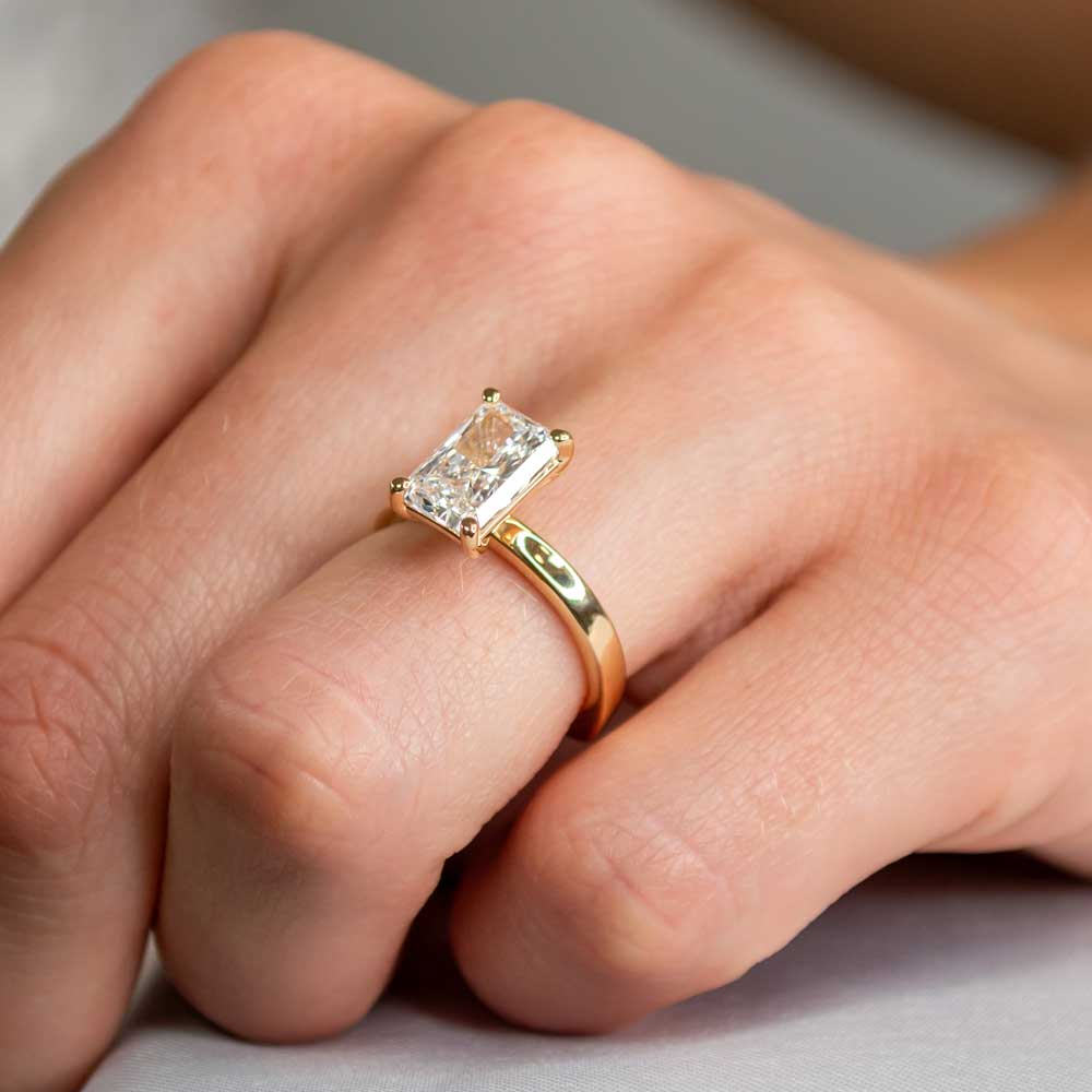 Solitaire engagement ring with bold shank in yellow gold by Lisa Robin