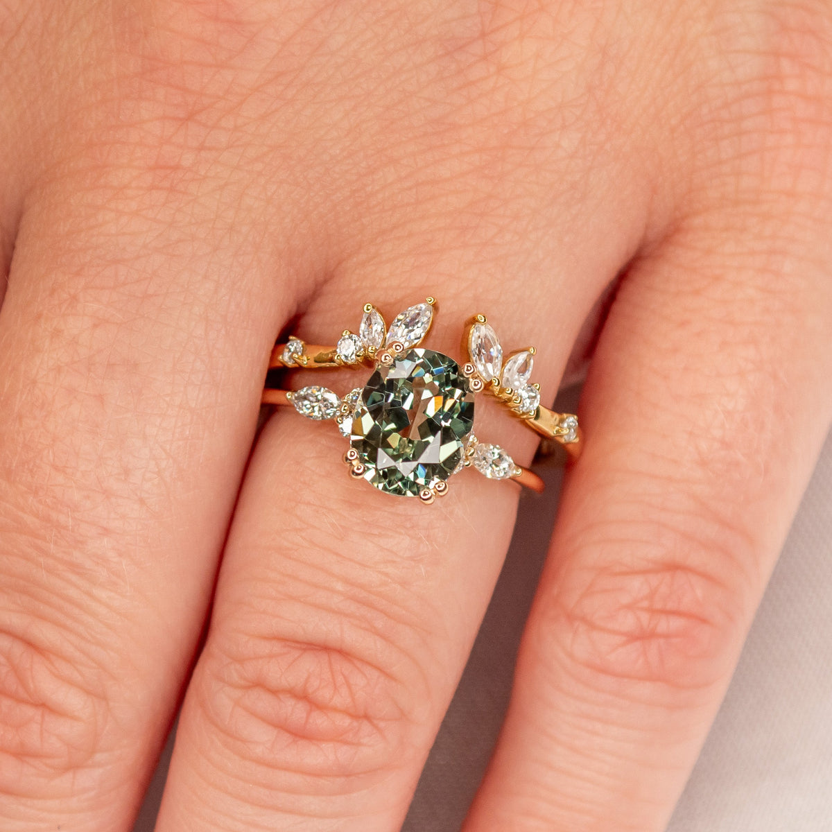 The Claire marquise curved open Diamond wedding Ring in 14K yellow gold on model hand by Lisa Robin jewelry 