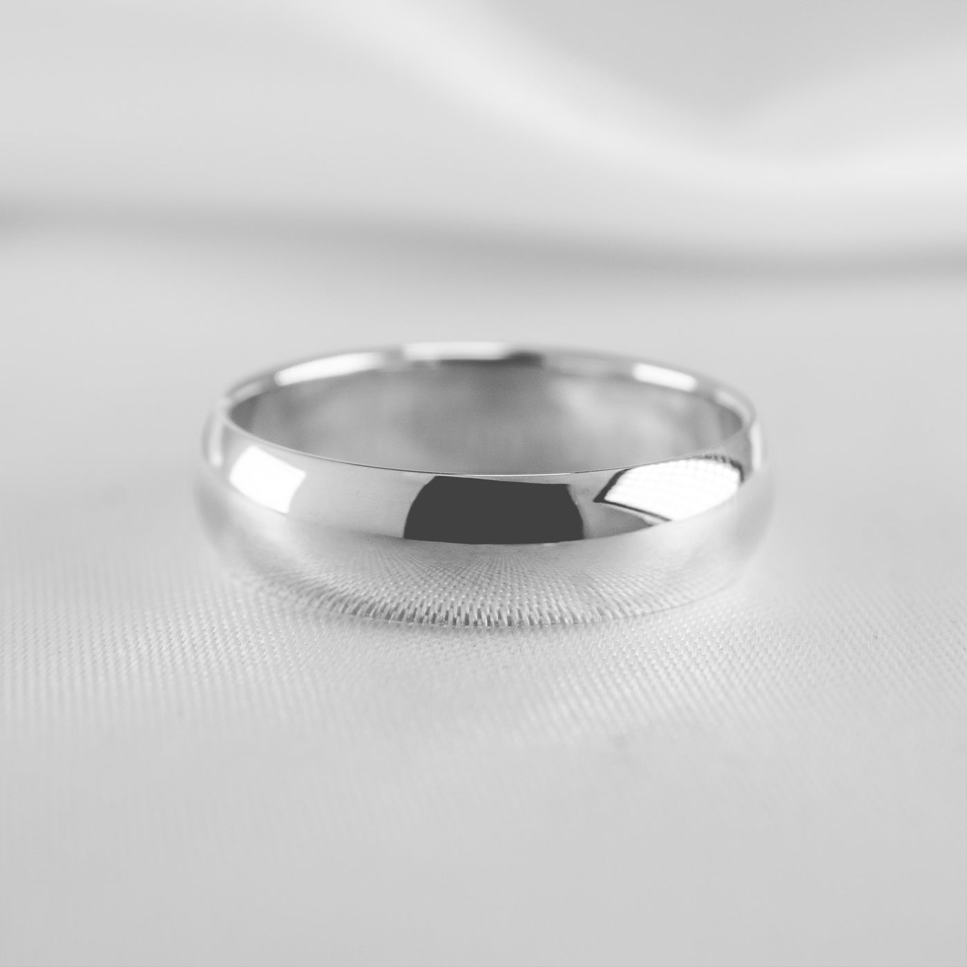 The Tanner gold wedding ring in 8mm#color_10k-white-gold