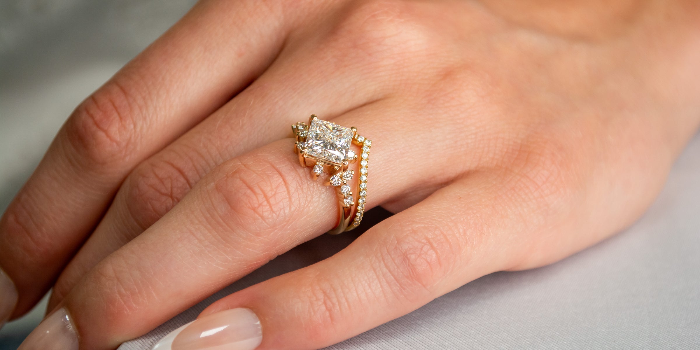 Chevron wedding ring with engagement ring on model | Lisa Robin