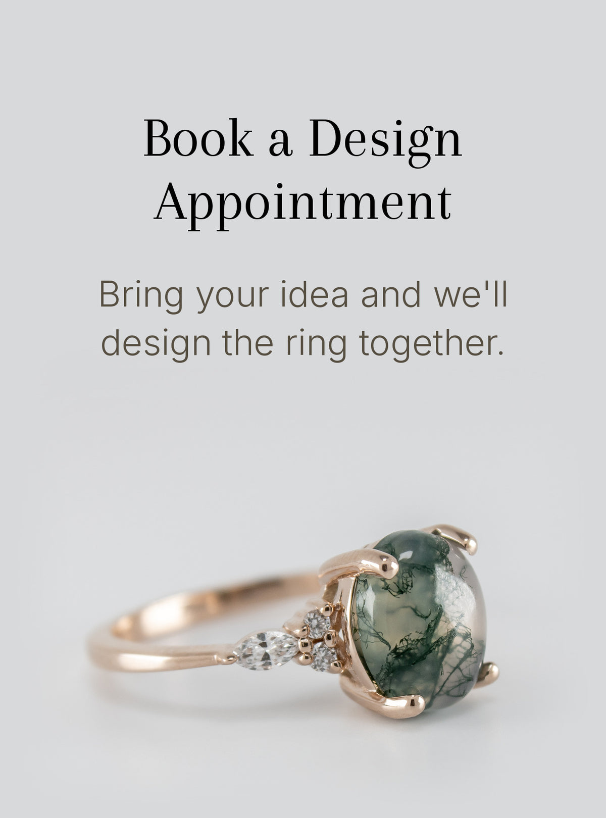 A rose gold ring with a large green marbled oval gemstone and small clear accent stones on the band, shown below text that reads 'Book a Design Appointment' and 'Bring your idea and we'll design the ring together.'.