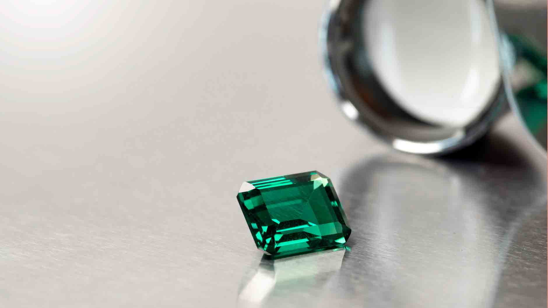 Emerald gemstone loose with loupe | Lisa Robin