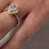 The Sierra Halo Engagement Ring with pear cut diamond in yellow gold paired with the Frances vintage diamond 14K yellow gold wedding ring on model hand by Lisa Robin jewelry