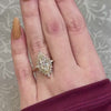 The Hadley Marquise Halo Diamond Engagement Ring with marquise cut diamond in yellow gold on model hand by Lisa Robin jewelry