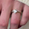The Stella Compass Set Solitaire Engagement Ring with asscher cut diamond in yellow gold paired with the Marla chevron lab diamond 14K yellow gold wedding ring on model hand by Lisa Robin Jewelry