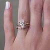 The Meredith Cathedral Diamond Engagement Ring with marquise cut diamond in yellow gold paired with the Claire Marquise Diamond Open 14K yellow gold Wedding Ring on model hand by Lisa Robin jewelry