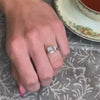 The Mia east west emerald cut Diamond Engagement Ring in yellow gold on model hand by Lisa Robin jewelry