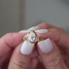 The Fable Victorian Style Diamond Engagement Ring with pear cut diamond in yellow gold on model hand by Lisa Robin jewelry