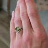 The Galaeth Cluster Green Diamond Engagement Ring with cushion cut diamond in yellow gold on model hand by Lisa Robin jewelry